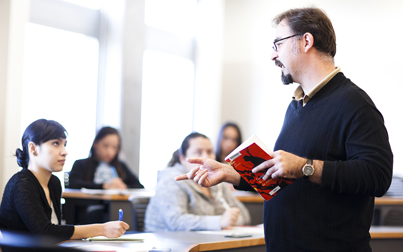 Literature Professor Ignacio Lopez-Calvo with students